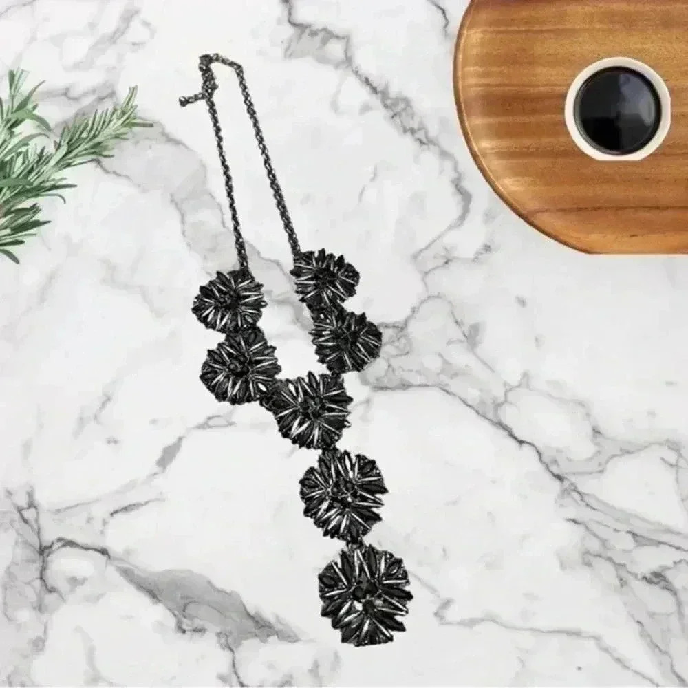NWOT SILVER AND BLACK FLOWER NECKLACE